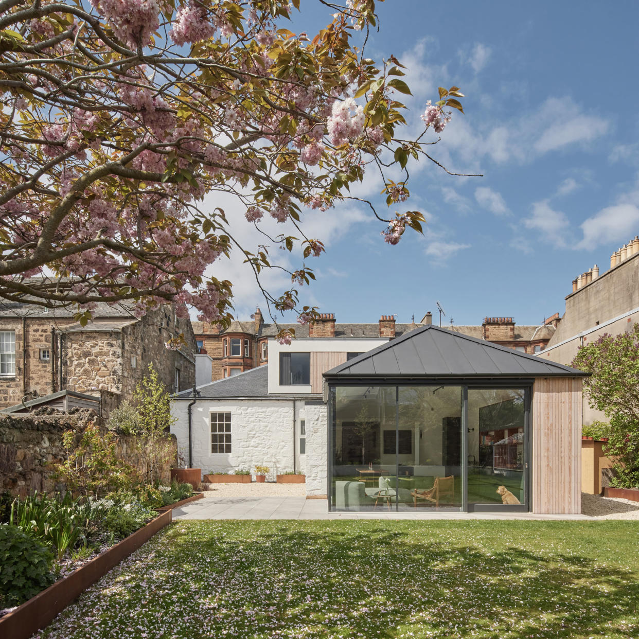  exterior of a traditional listed property with a contemporary kitchen extension 