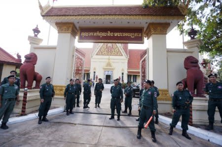 Police officers stand guard at the Supreme Court during a hearing to decide whether to dissolve the main opposition Cambodia National Rescue Party (CNRP), in Phnom Penh, Cambodia, November 16, 2017. REUTERS/Samrang Pring