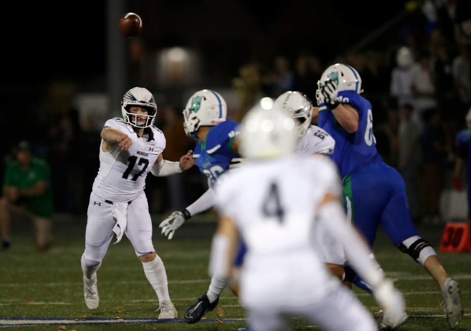 Menasha's Logan Liegl passes the ball to Parker Wienandt (4) during a game against Green Bay Notre Dame on Sept. 29 in Green Bay. The Bluejays play at Grafton in the third round Friday.