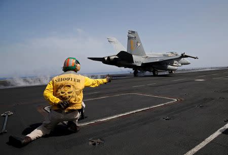 A US Navy F/A-18 fighter jet takes off from the USS Harry S. Truman aircraft carrier in the eastern Mediterranean Sea June 14, 2016. REUTERS/Baz Ratner