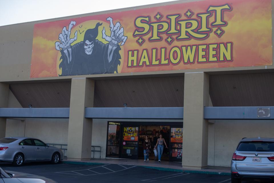 Customers walk out of a Spirit Halloween store in Northridge, Calif. in September 2023.