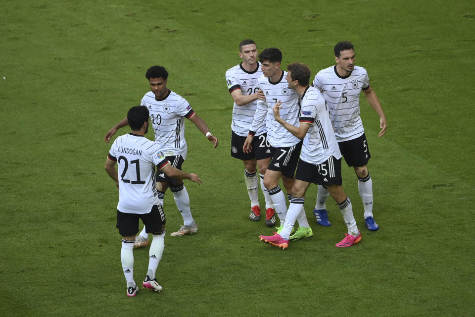 Germany's Kai Havertz, center, celebrates after scoring his side's opening goal during the Euro 2020 soccer championship group F match between Portugal and Germany at the football arena stadium in Munich, Saturday, June 19, 2021. (Matthias Hangst/Pool Photo via AP)