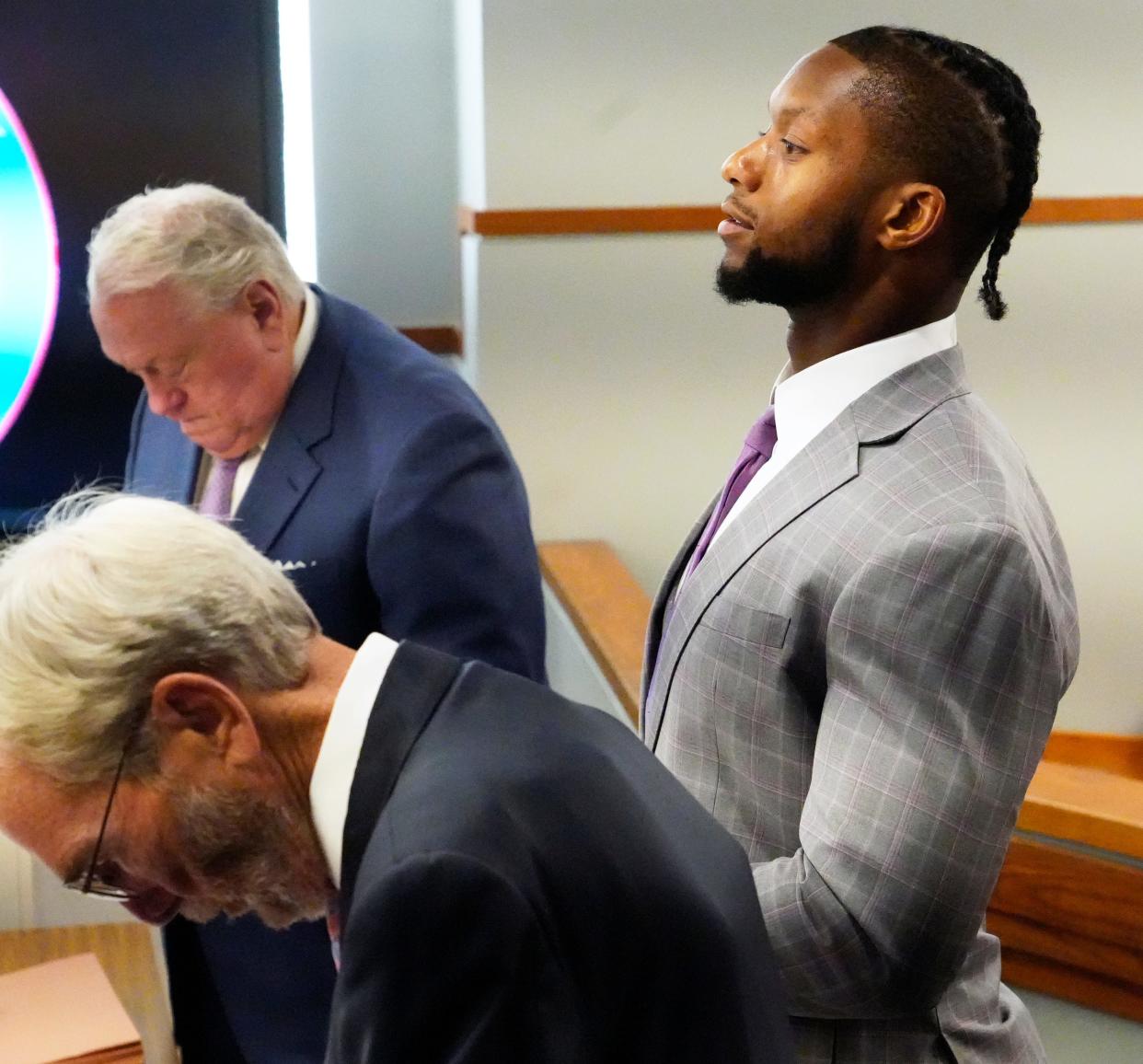 Cincinnati Bengals running back Joe Mixon stands at the start of day two of his aggravated menacing bench trial, Tuesday, August 15, 2023. His attorney’s are Meryln Shiverdecker, left, and Scott Croswell. Hamilton County Municipal Judge Gwen Bender is presiding over what prosecutors say was a road-rage incident involving a gun on Jan. 21, 2023 in downtown Cincinnati. 