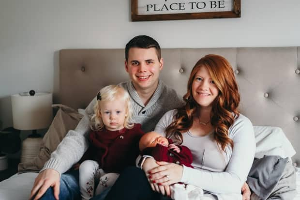 Shirley Ketola, right, was scheduled to have kidney stones removed on April 15, but the surgery was cancelled due to the rising number of COVID-19 patients requiring hospital care. Ketola is seen here with her husband Jacob, their daughter Grace and infant son Winston. (Gracie Laura Photography - image credit)