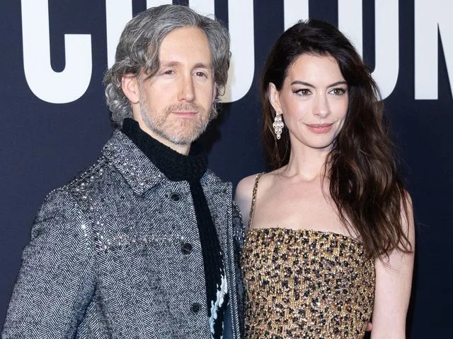 <p>Marc Piasecki/WireImage</p> Adam Shulman and Anne Hathaway