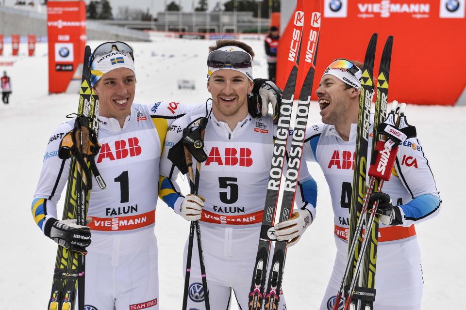 Winner Teodor Peterson, center, second placed Emil Joensson, right, and third placed Calle Halfvarsson, all of Sweden, celebrate after the final FIS Cross-Country World Cup Men's 1.4 km Sprint Classic in Falun, Sweden, Friday March 14, 2014. (AP Photo/Anders Wiklund) SWEDEN OUT