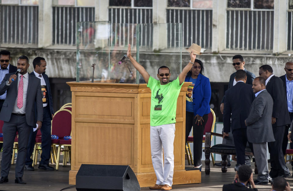 FILE - In this Saturday, June 23, 2018 file photo, Ethiopia's Prime Minister Abiy Ahmed waves to the crowd at a large rally in his support, in Meskel Square in the capital, Addis Ababa, Ethiopia. Ethiopia's ruling coalition is expected to take the next steps this week on sweeping reforms announced under its new prime minister as it begins its first congress on Wednesday, Oct. 3, 2018 since Ahmed took power in April. (AP Photo/Mulugeta Ayene, File)