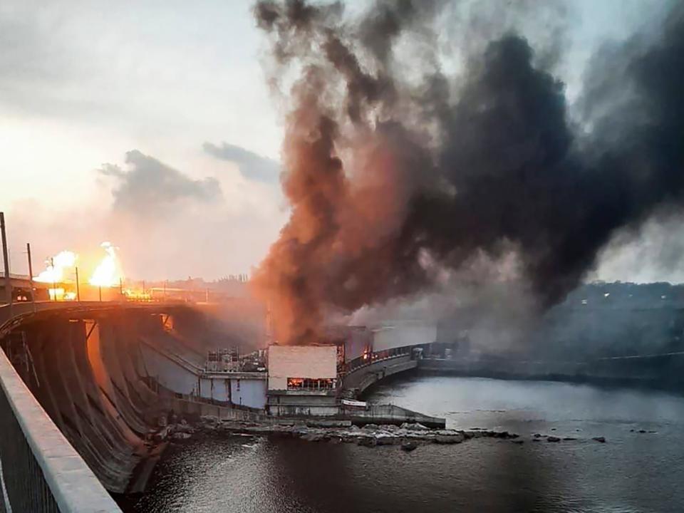 In this photo provided by Telegram Channel of Ukraine's Prime Minister Denys Shmyhal, smoke and fire rise over the Dnipro hydroelectric power plant after Russian attacks in Dnipro, Ukraine, Friday, March 22, 2024.