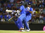 Ravichandran Ashwin (L) and MS Dhoni collide on the pitch as they gather runs during their win against the West Indies at the Cricket World Cup in Perth, March 6, 2015. REUTERS/David Gray