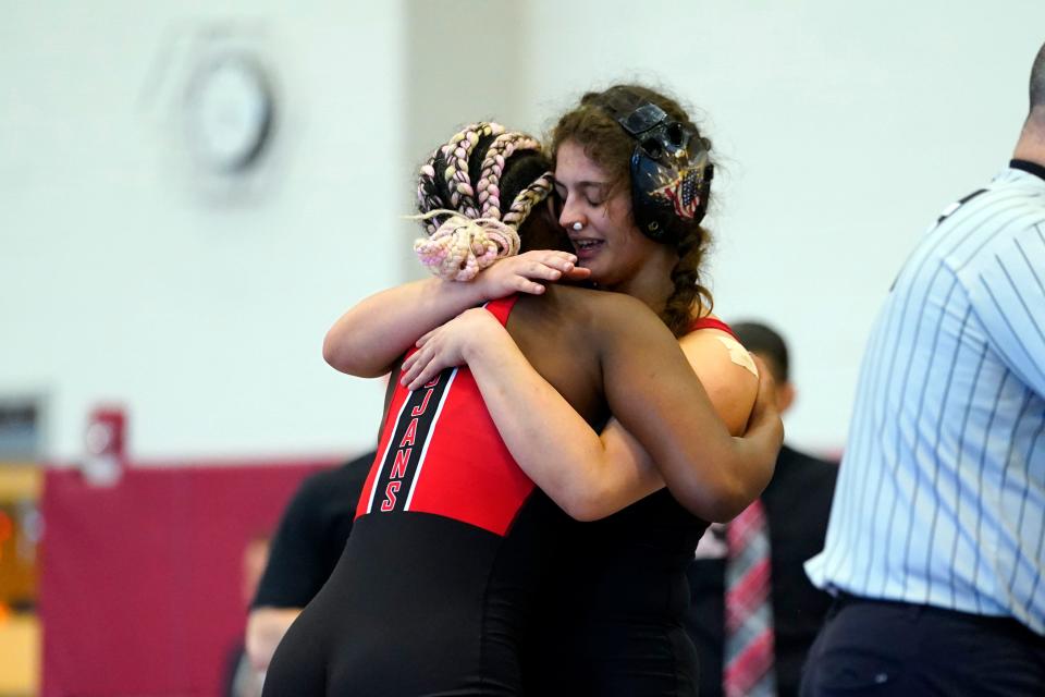 Saniyah Queen of Saint Thomas Aquinas, left, and Samira Kupa of Boonton hug after their semifinal bout during the NJSIAA girls state wrestling tournament at Phillipsburg High School on Sunday, Feb. 26, 2023.