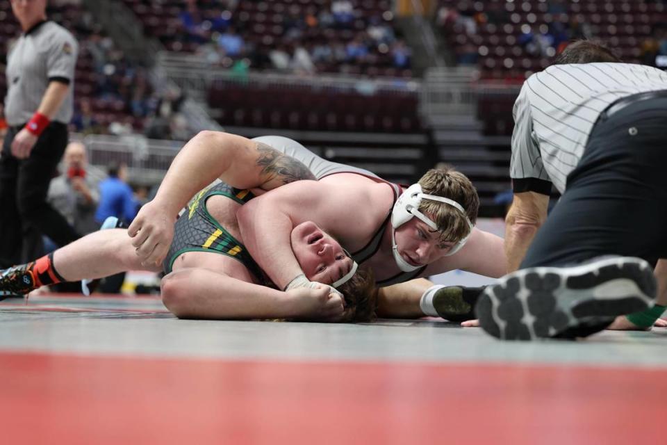 State College’s Nick Pavlechko looks for the pin of Penn Trafford’s Joe Enick in their 285-pound quarterfinals match of the PIAA Class 3A Championships on Friday, March 10, 2023 at the Giant Center in Hershey. Pavlechko did pin Enick in 5:24.