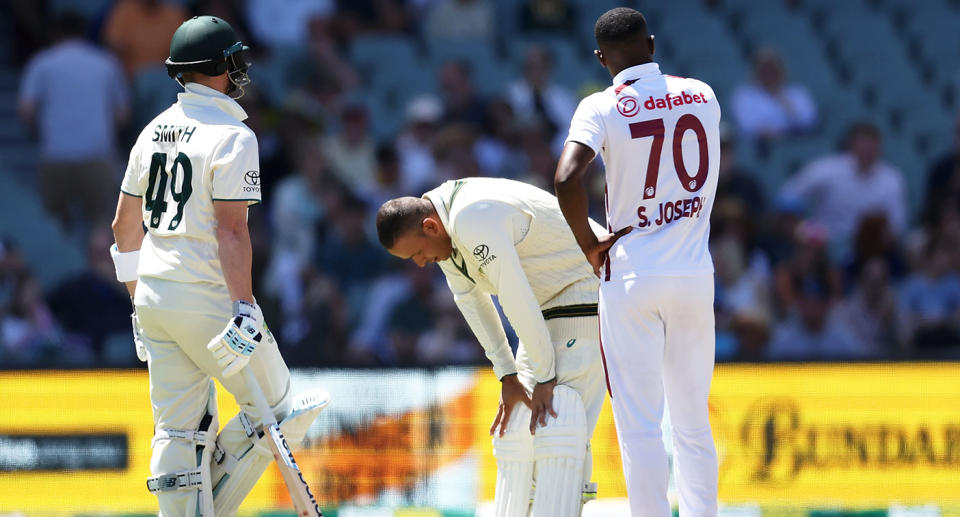 Usman Khawaja was in obvious discomfort after being hit in the helmet by a short ball. Pic: Getty