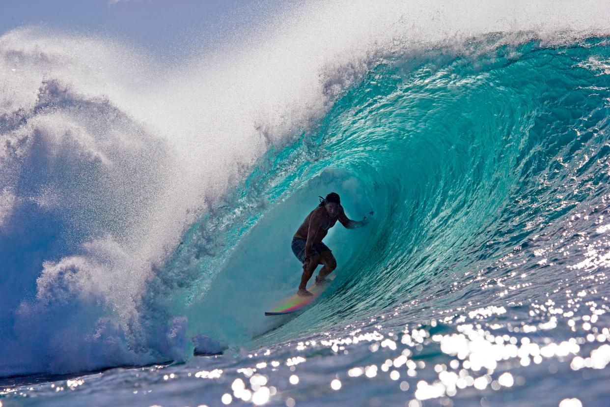 Tamayo Perry surfs while practicing for Da Hui Backdoor shootout at the Pipeline Masters on Oahu's North Shore, Hawaii, on Jan. 2, 2019.