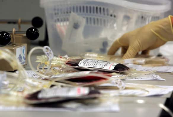 Cord blood samples are processed for cryopreservation at a Singapore laboratory in this file photo from August 26, 2005.  (Luis Enrique Ascui/Reuters - image credit)