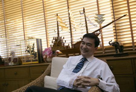 Thailand's opposition leader and former Prime Minister Abhisit Vejjajiva smiles during an interview with foreign media at his Democrat Party headquarters in Bangkok April 23, 2014. REUTERS/Darren Whiteside