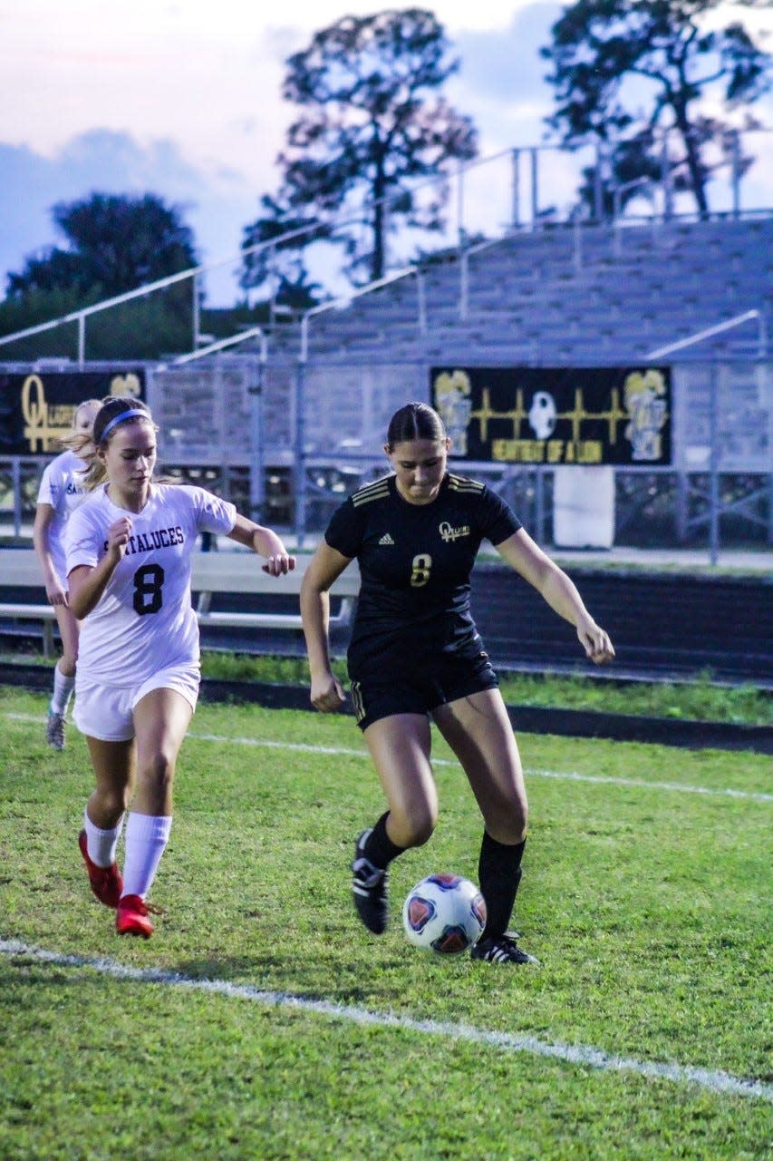 Olympic Heights freshman Francesca Rojas (8) dribbles in a match against Santaluces during the 2021-22 high school soccer season. Rojas scored her 31st goal of the season in the match.