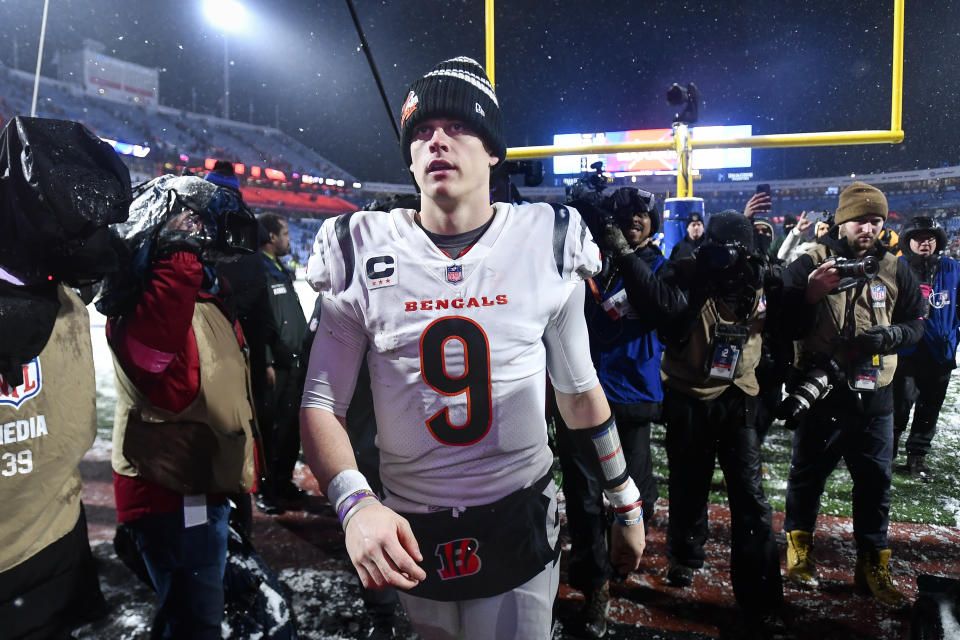 Cincinnati Bengals quarterback Joe Burrow (9) walks off the field after the Bengals beat the Buffalo Bills 27-10 in an NFL division round football game, Sunday, Jan. 22, 2023, in Orchard Park, N.Y. (AP Photo/Adrian Kraus)