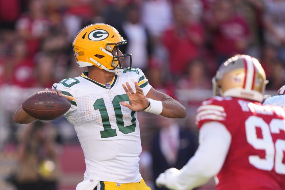 Packers quarterback Jordan Love (10) passes against San Francisco 49ers defensive end Kerry Hyder Jr. (92) during the first quarter of a preseason game on Aug. 12, 2022, in Santa Clara, Calif.