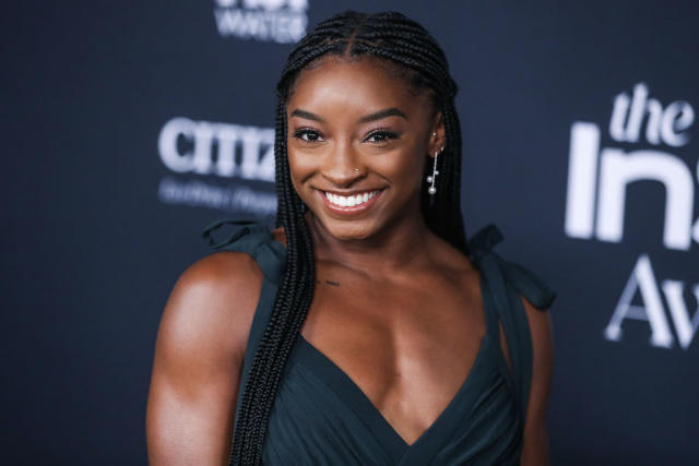 Simone Biles Wears an Orange Gingham Corset Top on Instagram