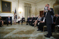 Sandy Hook parent Mark Barden holds a photo of his deceased son Daniel, a victim of the Sandy Hook School shooting in Connecticut, as he participates in a listening session held by U.S. President Donald Trump with surviving high school students, teachers and the families of school shooting victims to discuss school safety and shootings at the White House in Washington, U.S., February 21, 2018 REUTERS/Jonathan Ernst