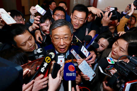 Yi Gang, deputy governor of the People's Bank of China (PBOC), talks to the media at the Great Hall of the People during the seventh plenary session of the National People's Congress (NPC) in Beijing, China March 19, 2018. REUTERS/Stringer