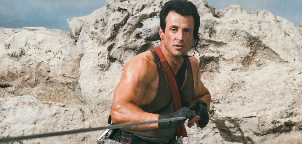 USA. Sylvester Stallone in a scene from the (C)TriStar Pictures movie: Cliffhanger (1993) . Plot: A botched mid-air heist results in suitcases full of cash being searched for by various groups throughout the Rocky Mountains. Ref: LMK110-J7244-260721  Supplied by LMKMEDIA. Editorial Only. Landmark Media is not the copyright owner of these Film or TV stills but provides a service only for recognised Media outlets. pictures@lmkmedia.com