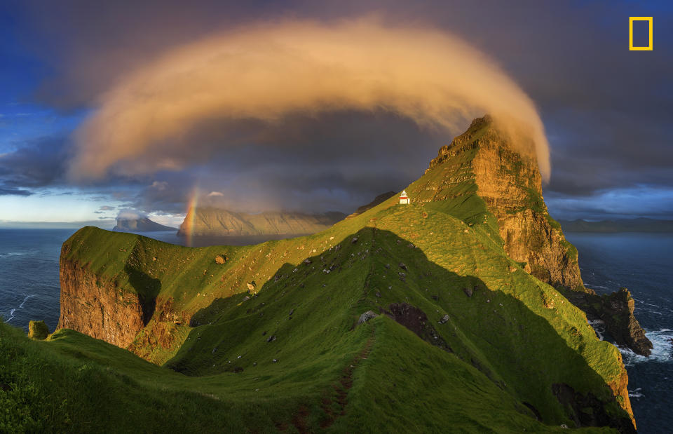 <p>“Kalsoy island and Kallur lighthouse in sunset light, Faroe Islands.” (<a rel="nofollow noopener" href="http://yourshot.nationalgeographic.com/profile/1410748/" target="_blank" data-ylk="slk:Wojciech Kruczyński;elm:context_link;itc:0;sec:content-canvas" class="link ">Wojciech Kruczyński</a> / National Geographic Nature Photographer of the Year contest) </p>