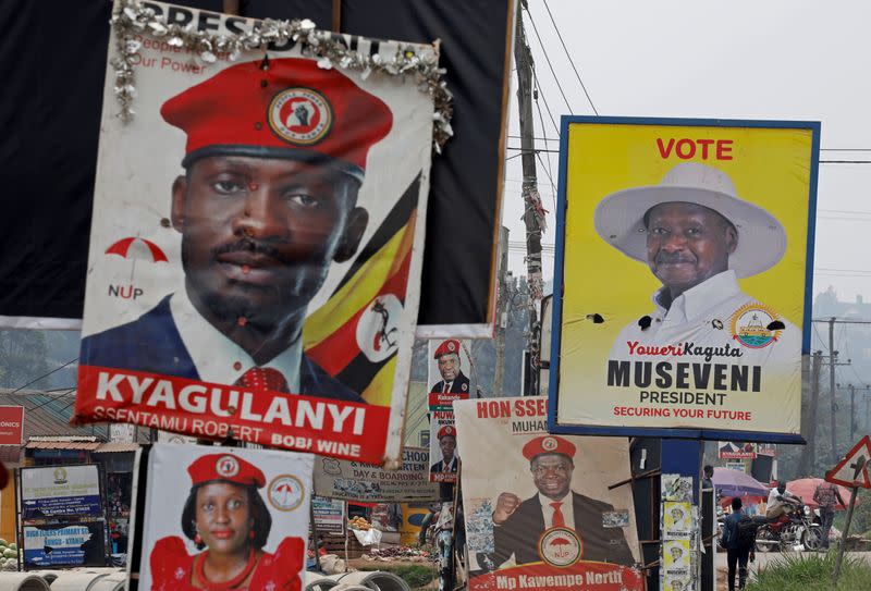 Elections billboards for Uganda's President Yoweri Museveni, and opposition leader and presidential candidate Robert Kyagulanyi, also known as Bobi Wine, are seen on a street in Kampala