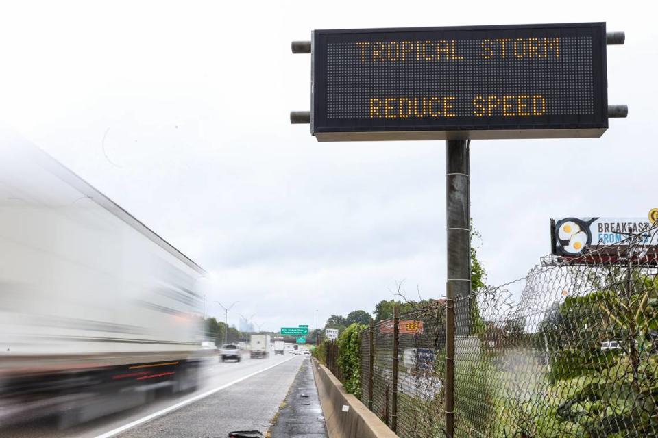 A sign along I-85 northbound cautions drivers to slow down due to inclement weather as a result of Hurricane Ian on Friday, September 30, 2022 in Charlotte, NC.