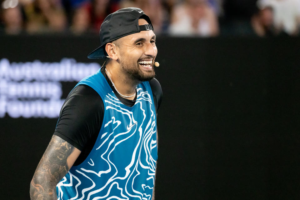 Nick Kyrgios smiles during an exhibition match.