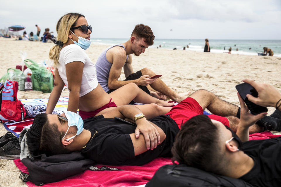 Image: Beachgoers relax on South Beach in Miami on June 19, 2020. (Scott McIntyre / The Washington Post via Getty Images file)