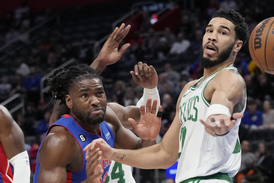 Detroit Pistons center Isaiah Stewart left, and Boston Celtics forward Jayson Tatum (0) watch the ball go out of bounds during the first half of an NBA basketball game, Monday, Feb. 6, 2023, in Detroit. (AP Photo/Carlos Osorio)