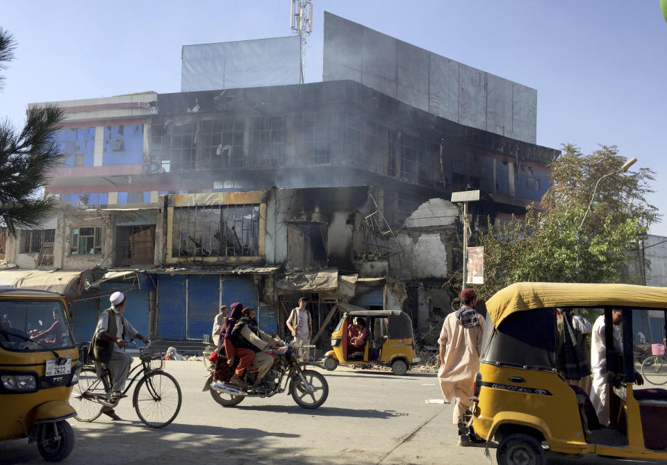 Shops are damaged shops after fighting between Taliban and Afghan security forces in Kunduz city, northern Afghanistan, Sunday, Aug. 8, 2021. Taliban fighters Sunday took control of much of the capital of Kunduz province, including the governor's office and police headquarters, a provincial council member said. (AP Photo/Abdullah Sahil)