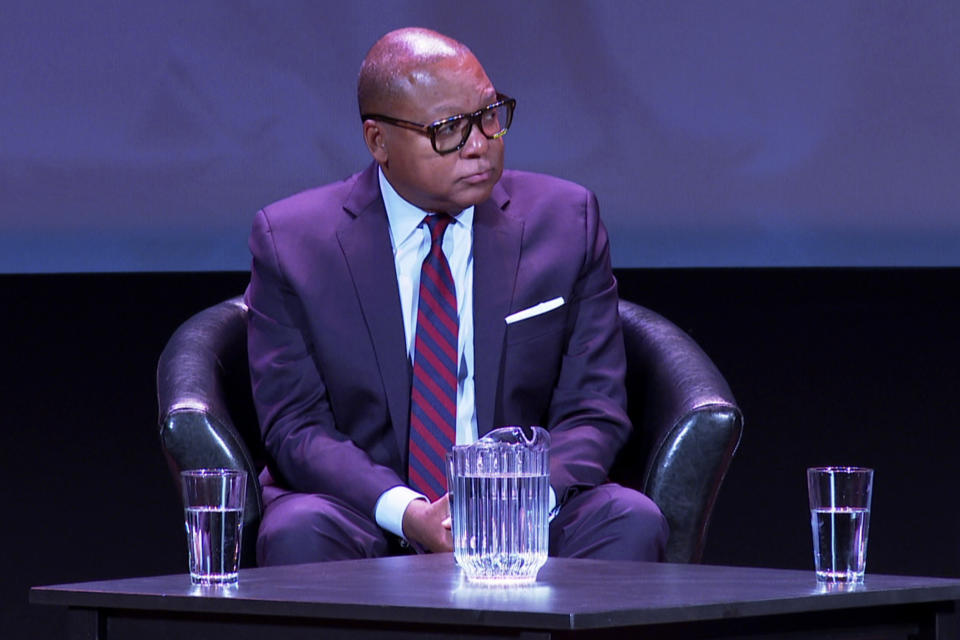 In this image made from video, Wynton Marsalis listens to another speaker during a lecture/discussion at the Michigan Theater on Wednesday, Oct. 12, 2022, in Ann Arbor, Mich. The Grammy and Pulitzer winner is taking part in a week-long residency at the University of Michigan. (AP Photo/Mike Householder)