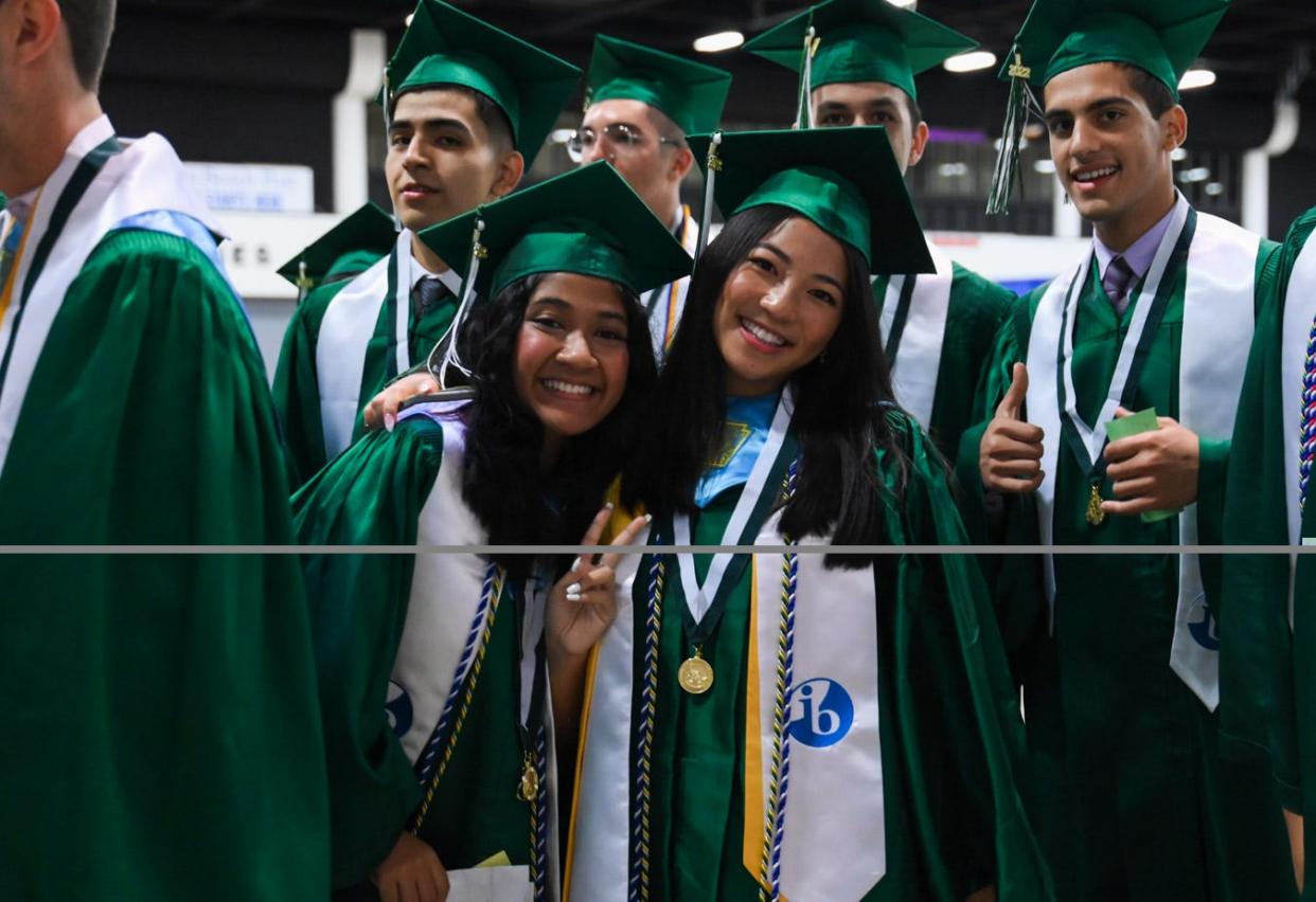 Atlantic Community High School students are seen preparing before the Atlantic Community High School's 2022 graduation ceremony at the South Florida Fairgrounds and Expo Center in unincorporated Palm Beach County, Fla., on Saturday, May 21, 2022.