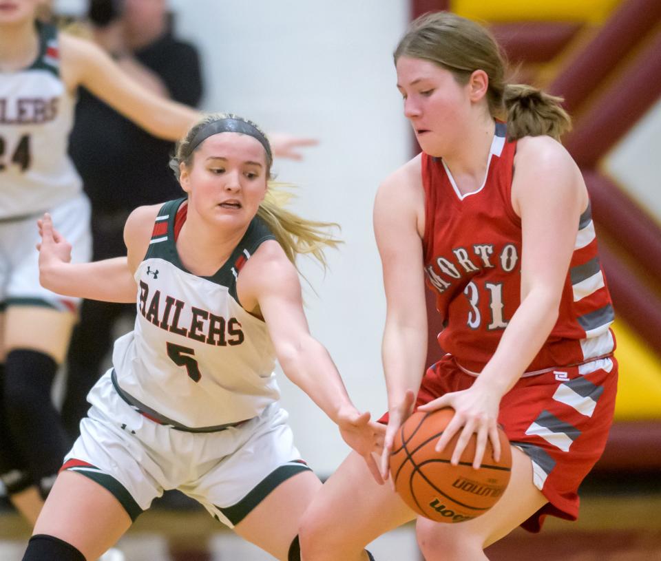 Lincoln's Kloe Froebe, left, tries to poke the ball away from Morton's Paige Selke in the first half of their Class 3A girls basketball sectional championship Thursday, Feb. 22, 2024 at East Peoria High School. The Railsplitters advanced to the super-sectional with a 61-30 win.