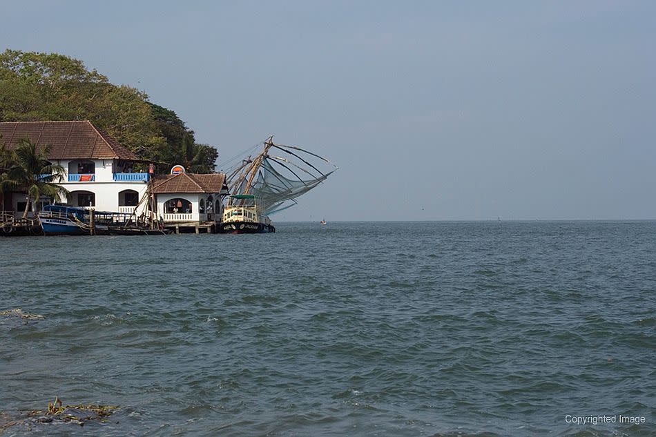 <p><b>The seaside today with Chinese fishing nets in the background.</b><br>©Donald Fels / Published in ‘Mosques of Cochin’ by Patricia Tusa Fels<br>It was with the arrival of Vasco da Gama and the Portuguese attempt to control all overseas commerce that violence entered the trading world of Malabar. From the sixteenth to the nineteenth century, change swirled around the people of the coast. The Portuguese were replaced by the Dutch and then the English. Fort Cochin, at the northern tip of a peninsula, became the first European settlement in India, and one of the few with a history of Portuguese, Dutch and English presence.</p>