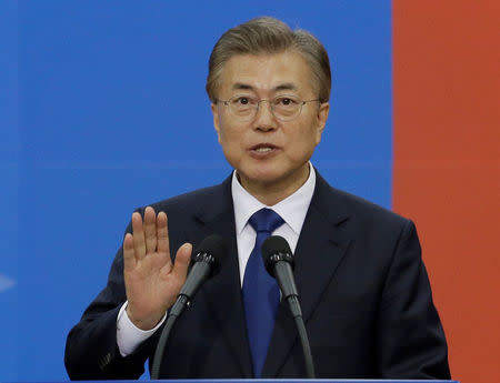 FILE PHOTO: Newly elected South Korean President Moon Jae-in takes an oath during his inauguration ceremony at the National Assembly in Seoul, South Korea, May 10, 2017. REUTERS/Ahn Young-joon/Pool/File Photo