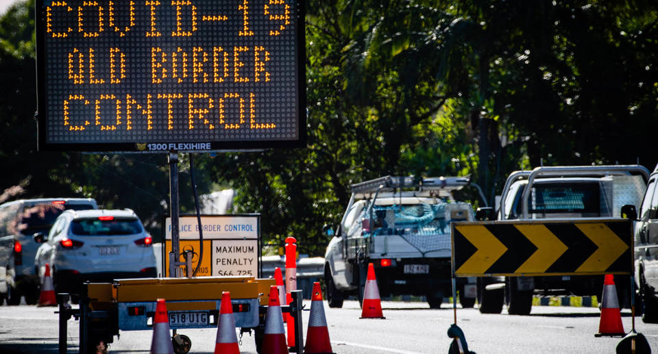 A sign on the road at the Queensland border reading: 'Covid-19 Queensland border control.'