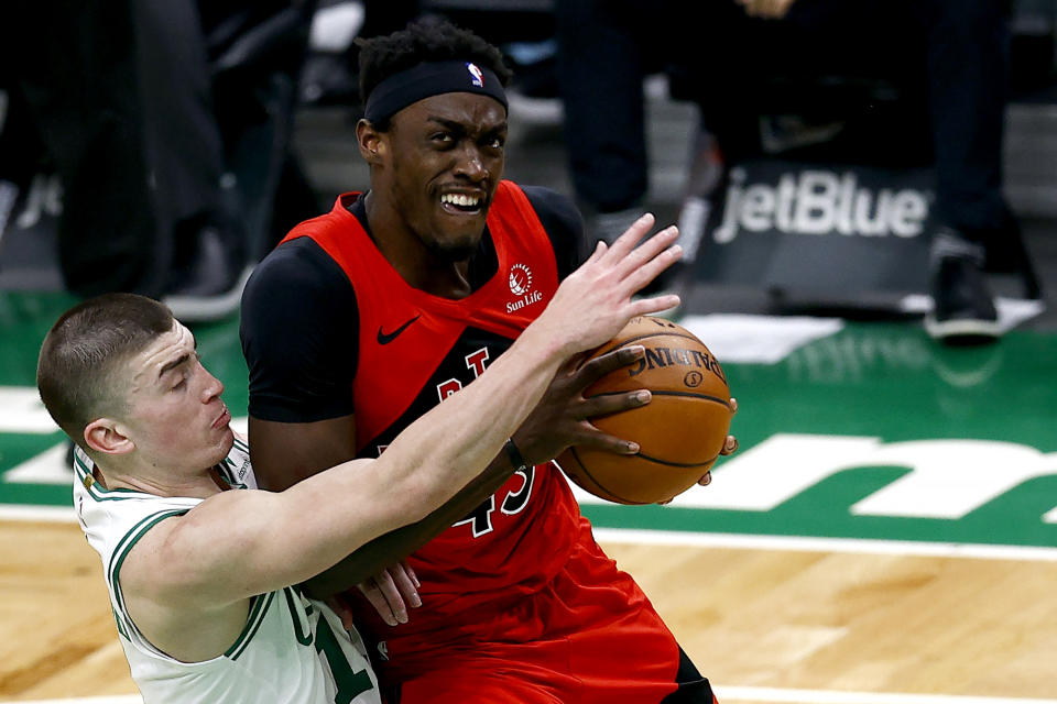 BOSTON, MASSACHUSETTS - FEBRUARY 11: Pascal Siakam #43 of the Toronto Raptors looks to pass around Payton Pritchard #11 of the Boston Celtics during the first second at TD Garden on February 11, 2021 in Boston, Massachusetts. NOTE TO USER: User expressly acknowledges and agrees that, by downloading and or using this photograph, User is consenting to the terms and conditions of the Getty Images License Agreement. (Photo by Maddie Meyer/Getty Images)