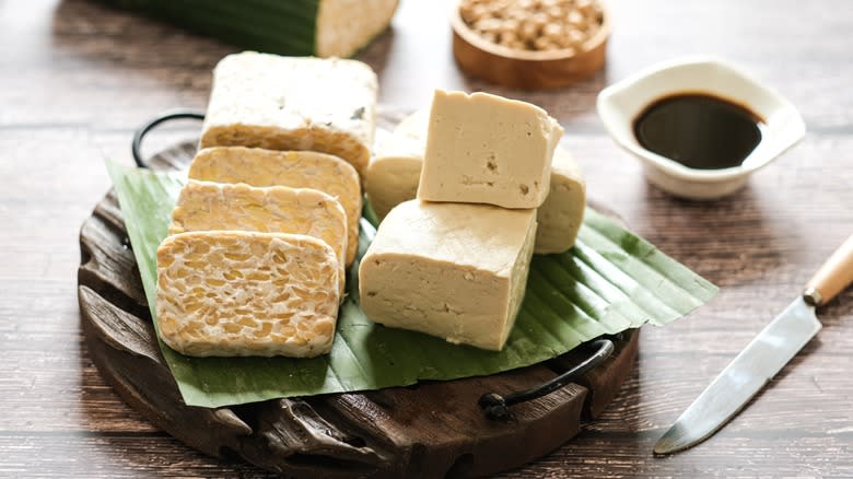 Blocks of raw tempeh and tofu