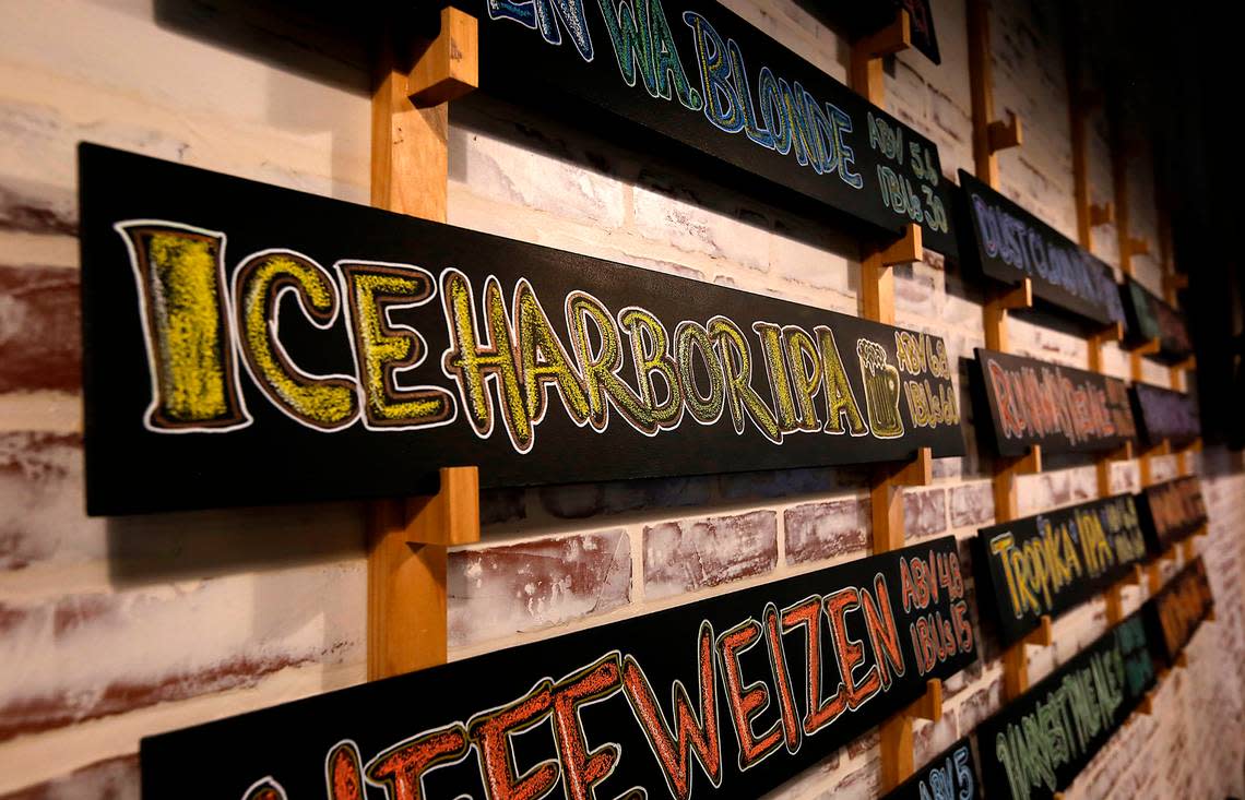 Colorful signs for beers offered at Ice Harbor Brewery in Kennewick are posted on the wall in the downtown Kennewick location for the popular brewery and restaurant.