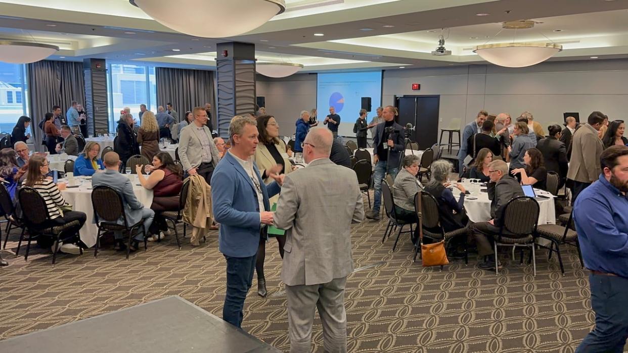 About 200 members of the Edmonton Chamber of Commerce gathered at the Delta Hotel in the city's downtown on Tuesday, Feb. 8, 2024, to discuss how businesses can play a role in finding solutions to Edmonton’s homelessness crisis. (Aaron Sousa/CBC - image credit)