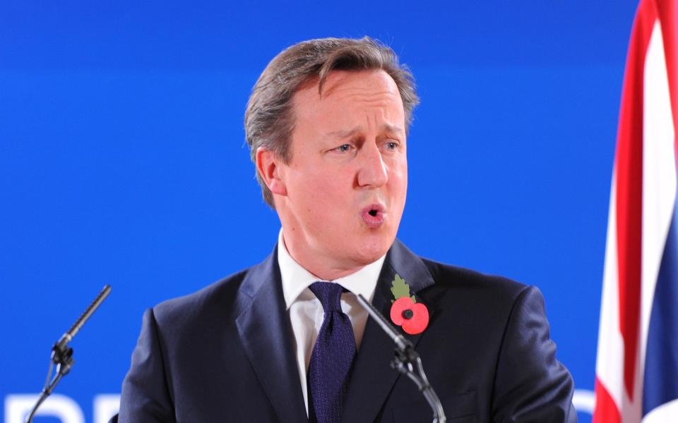 BRUSSELS, BELGIUM - OCTOBER 24 :  British Prime Minister David Cameron speaks during a press conference at the end of a two-day European Council meeting in Brussels, Belgium on October 24, 2014. (Photo by Dursun Aydemir/Anadolu Agency/Getty Images)