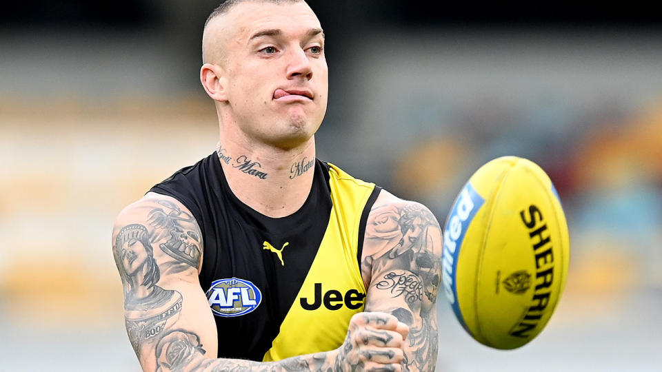 Richmond star Dustin Martin got away with a fine after punching Port Adelaide's Tom Rockliffe in the throat. (Photo by Bradley Kanaris/Getty Images)