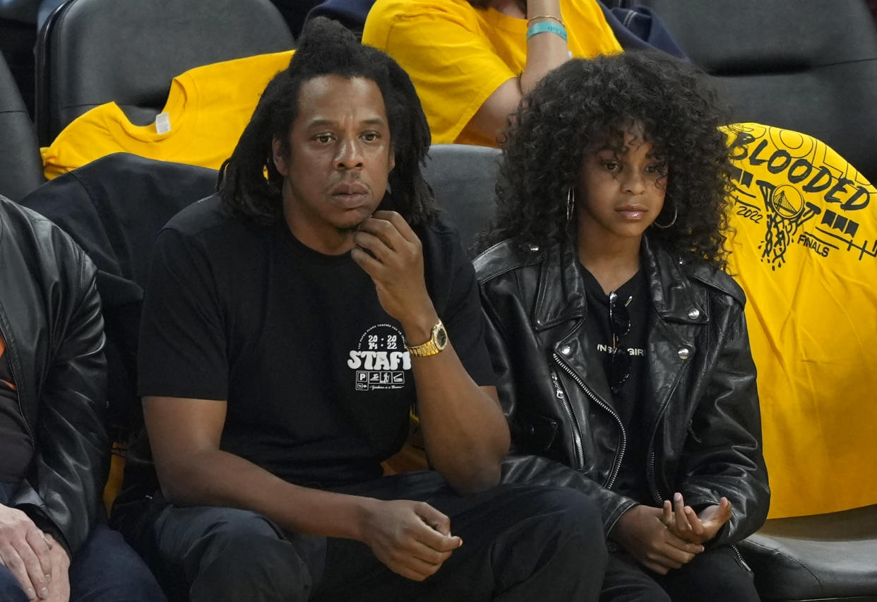 Rapper Jay-Z and his daughter Blue Ivy Carter look on during the second quarter of Game Five of the 2022 NBA Finals between the Boston Celtics and the Golden State Warriors at Chase Center on June 13, 2022 in San Francisco, California. NOTE TO USER: User expressly acknowledges and agrees that, by downloading and/or using this photograph, User is consenting to the terms and conditions of the Getty Images License Agreement. (Photo by Thearon W. Henderson/Getty Images)