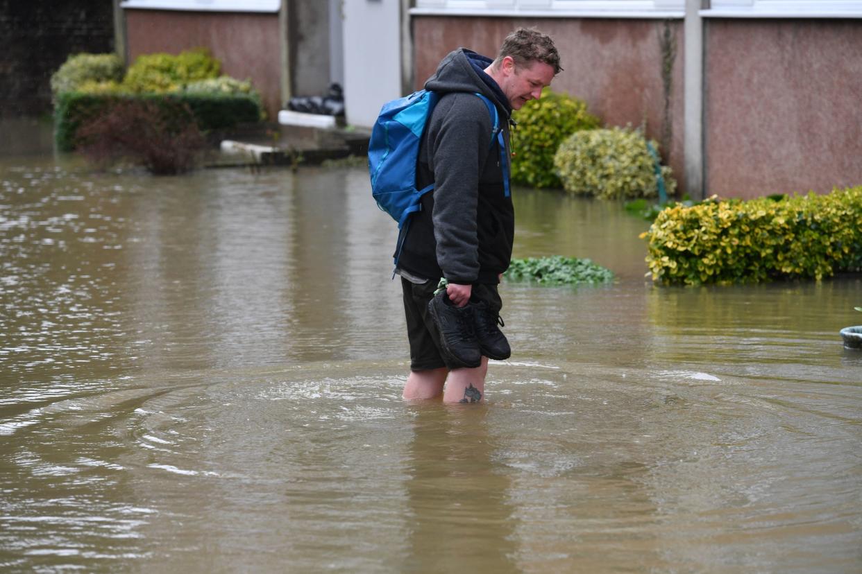 A man surveys the flooding in Berwick Road, Shrewsbury, near the River Severn: PA