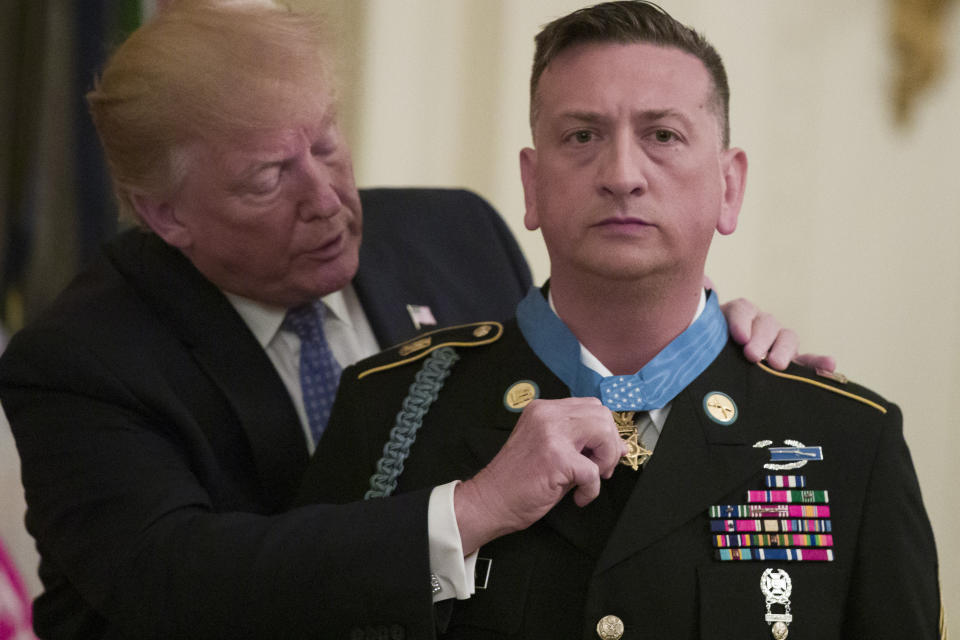 President Donald Trump awards the Medal of Honor to Army Staff Sgt. David Bellavia in the East Room of the White House in Washington, Tuesday, June 25, 2019, for conspicuous gallantry while serving in support of Operation Phantom Fury in Fallujah, Iraq. (AP Photo/Alex Brandon)