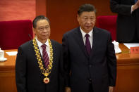 Chinese President Xi Jinping, right, stands with Chinese medical expert Zhong Nanshan after awarding him a medal at an event to honor some of those involved in China's fight against COVID-19 at the Great Hall of the People in Beijing, Tuesday, Sept. 8, 2020. Chinese leader Xi Jinping is praising China's role in battling the global coronavirus pandemic and expressing support for the U.N.'s World Health Organization, in a repudiation of U.S. criticism and a bid to rally domestic support for Communist Party leadership. (AP Photo/Mark Schiefelbein)