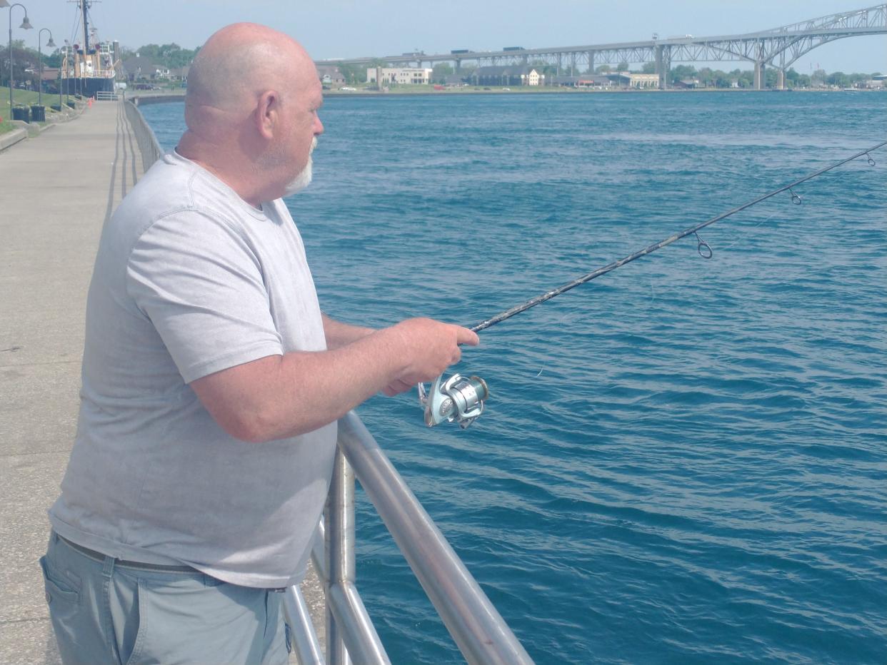 Bill Taylor of Port Huron fishes at Pine Grove Park for salmon and walleye on May 22, 2024. He says Walleye are easy to find all along the St. Clair River, but will become less common in June as the summer heat sets in.